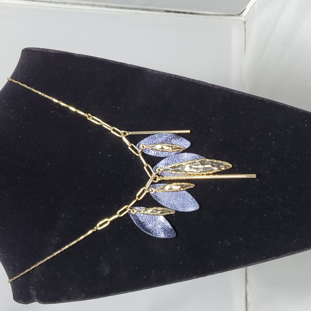 French connection gold chain with navy leaf leatherette